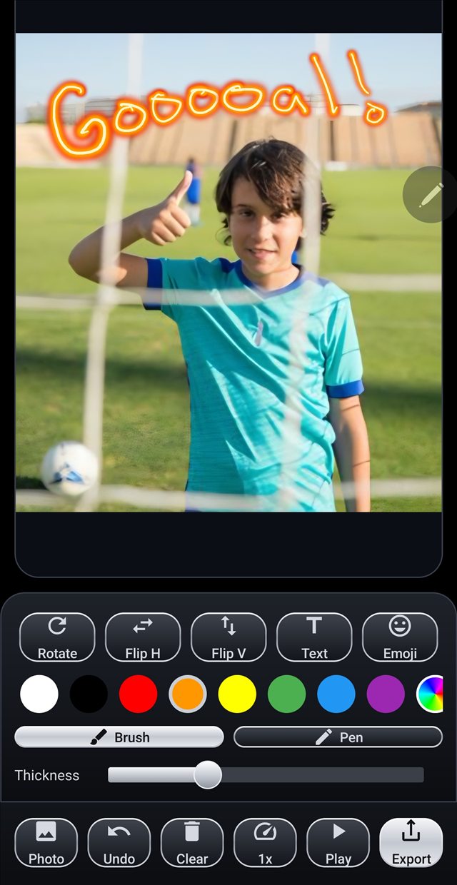 Strokara editor with a glowing Goal message drawn over a soccer photo